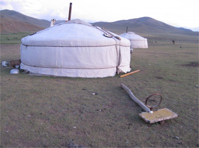 We stayed in this ger for a night. You can see some dairy products being dried on the roof, a fallen basketball hoop, and part of a solar panel on the other side of a ger.