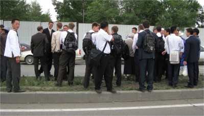 Over a dozen Mormon missionaries on an Ulaanbaatar, Mongolia street. Mongolia has one of the highest number of Mormon missionaries per capita in the world. Why? Low incomes and a rapidly growing economy make people realize the "good life" is possible. Realistically hopeful people make for easy conversions. 