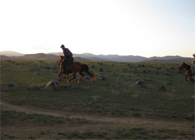 Some herders at sunset proving that motorized transportation isn't always the best. Notice the menacing terrain.