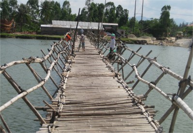 If there's one thing I've done consistently while traveling, it is getting lost. I leave the hotel without a compass, watch, map, or GPS. I intentionally take the less traveled roads. In this picture, I am returning from My Son, a famous World Heritage site of ancient civilization. When I came to this bamboo bridge on my return, I knew I was definitely lost. Time to get from hotel to My Son--1.5 hours. Time to get from My Son to hotel--4.5 hours. Tourists seen while lost--ZERO.