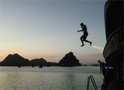 Part of the typical Halong Bay tourist package includes a night on a boat. With low expectations, I reluctantly caved into the practicality of working with a tour agency. Here I am having a great time, jumping off the boat's top level as the sun sets.