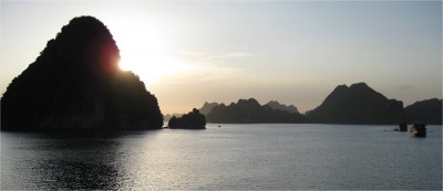 Taken near sunset on Halong Bay, the sun looks like it is burning through the karst.