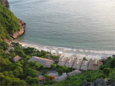 I was lucky enough to stay at a fairly secluded island in Halong Bay, Monkey Island. I climbed to the highest point on the karst formation to take this picture. My bungalow is one of the smaller ones to the left.