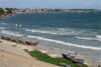 Mui Ne has nice, but eroding beaches. The winds are perfect for wind and kite surfing. At the far end, traditional fishermen dock their boats.