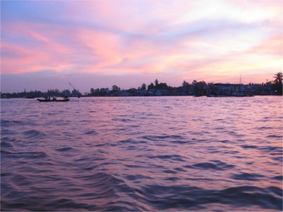 To get to the early morning floating markets of the Mekong Delta, I had to get up well before sunrise. This was one of only a very few days I've woken before sunrise in the past three months. Luckily, my reward was an incredible sunrise with pink skies.