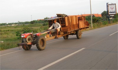 On the ride to the airport, I try to cram some final pictures I had planned on taking...like all the unusual forms of transportation.  They use these trailer beds to haul people around, too.