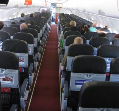 I have to say, this picture drives me a little crazy. In fact, I nearly wrote an entire article about it. See all the empty seats? There are MANY. I took this picture after everyone had boarded. I took my own row where I could stretch out. Now notice the girl with the hairbun thing in the window seat on the right side of the plane. She made the other two people in the row move so that she could get to her assigned seat. For some reason, all three of them sat in their assigned seats the entire flight. WHY?! I don't know why this gets me worked up, but it does!
