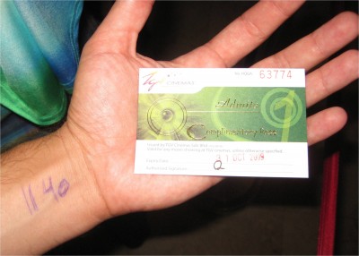 After the towers tour, I went to the mall right next door to make a layover plan for Beijing. After that I took in a movie. While in line, some woman offered to give me this free ticket for a couple dollars, which was less than the regular priced tickets. I accepted. You can see the writing on my wrist. That's my reminder of the next takeoff time. Unfortunately I didn't get to see the ending of Inglorious Bastards, and had to rush out of the theater to make my flight.