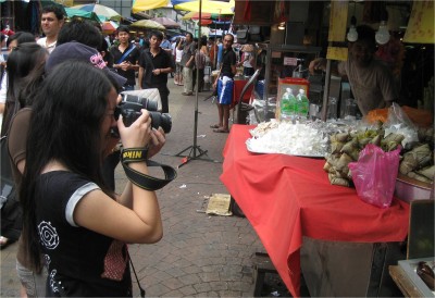 Hey, I told you, one of my favorite things to photograph is other people taking photographs. I find people more interesting subjects than the sticky rice it looks like they are capturing.